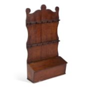 AN EARLY 19TH CENTURY OAK SPOON RACK