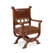 A LATE 19TH CENTURY WALNUT AND LEATHER UPHOLSTERED ARMCHAIR