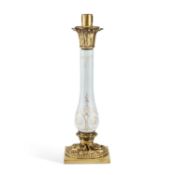 A GILT-BRASS AND OPALINE GLASS LAMP