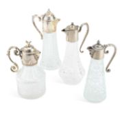 FOUR SILVER-PLATE MOUNTED GLASS CLARET JUGS