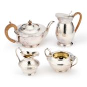 A 20TH CENTURY ELECTRO-PLATED ON ENGLISH PEWTER THREE-PIECE TEA SERVICE