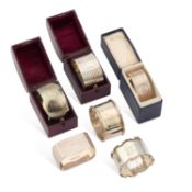 A GROUP OF SIX SILVER NAPKIN RINGS