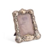 AN EDWARDIAN SILVER-MOUNTED PHOTOGRAPH FRAME