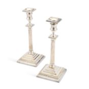 A PAIR OF 19TH CENTURY SILVER-PLATED COLUMNAR CANDLESTICKS