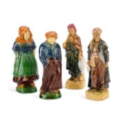 A GROUP OF FOUR CONTINENTAL POTTERY FIGURES
