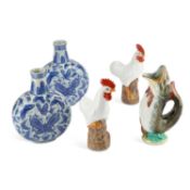 A CONTINENTAL MAJOLICA FISH GLUGGLE JUG
