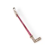A CONTINENTAL 14 CARAT GOLD PLATINUM RUBY AND DIAMOND HUNTING CROP BROOCH