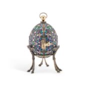 A LARGE RUSSIAN SILVER AND ENAMEL EGG ON STAND