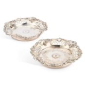 A PAIR OF 19TH CENTURY SILVER-PLATED COASTERS
