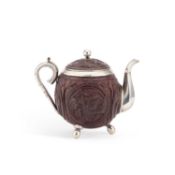 A LATE 19TH CENTURY INDIAN SILVER-MOUNTED COCONUT TEAPOT