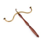A 19TH CENTURY BRASS AND MAHOGANY GOWN HOOK