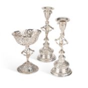A PAIR OF GERMAN SILVER CANDLESTICKS AND A CENTREPIECE