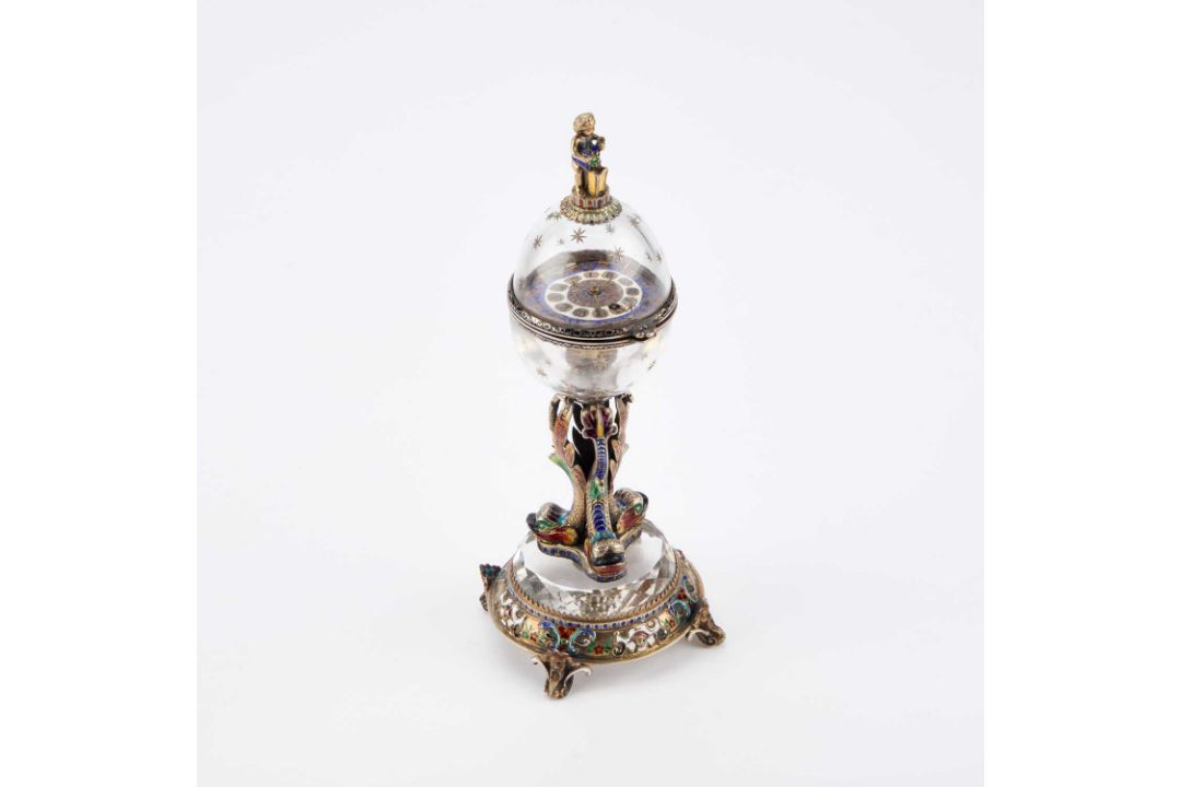 AN AUSTRIAN SILVER-GILT, ENAMEL AND ROCK CRYSTAL GLOBE CLOCK