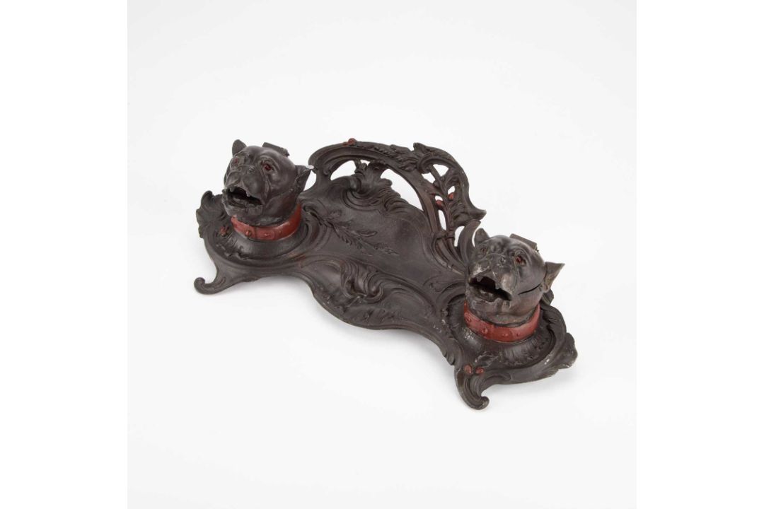 A FRENCH PATINATED METAL INKSTAND, CIRCA 1900