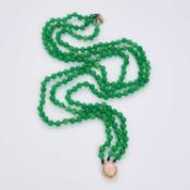 A JADEITE BEAD NECKLACE