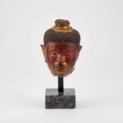 A CAMBODIAN CARVED STONE HEAD