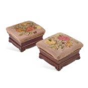 A PAIR OF VICTORIAN MAHOGANY AND NEEDLEWORK UPHOLSTERED FOOTSTOOLS