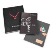 TWO TAG HEUER BOOKS AND A PORTFOLIO