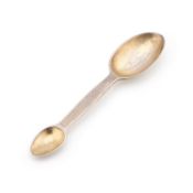 A GEORGE V SILVER-GILT MEDICINE SPOON