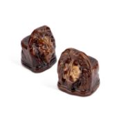 A PAIR OF TREACLE-GLAZED POTTERY SASH WINDOW STOPS, CIRCA 18760-70