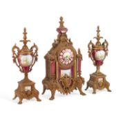 A LATE 19TH CENTURY FRENCH GILT-METAL AND MAGENTA-GROUND PORCELAIN CLOCK GARNITURE