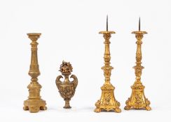 Lot comprising of a pair of table torch holders, a candlestick and a carved and gilded wooden finial