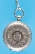 An engraved English silver pocket watch with pointed tooth anchor escapement and silver chain with k