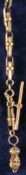 Gold-plated pocket watch chain with decorated hand as a pendant,