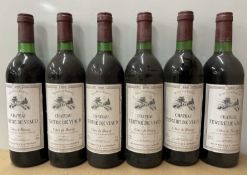 Twelve assorted vintage Bordeaux region wines