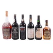 Six bottles of assorted vintage port, cognac, and whisky