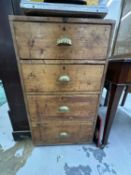 Furniture: an early 20th century pine four drawer filing cabinet, 91cm high.