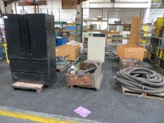 Three rows of skids with hose, flanges, drive belts, hoist, extensions, desk, steel plates, valve, w