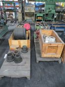 Seven skids with hose reels, drive shaft, flanges, misc. tools etc.