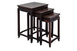 A SET OF THREE HARDWOOD NESTING TABLES