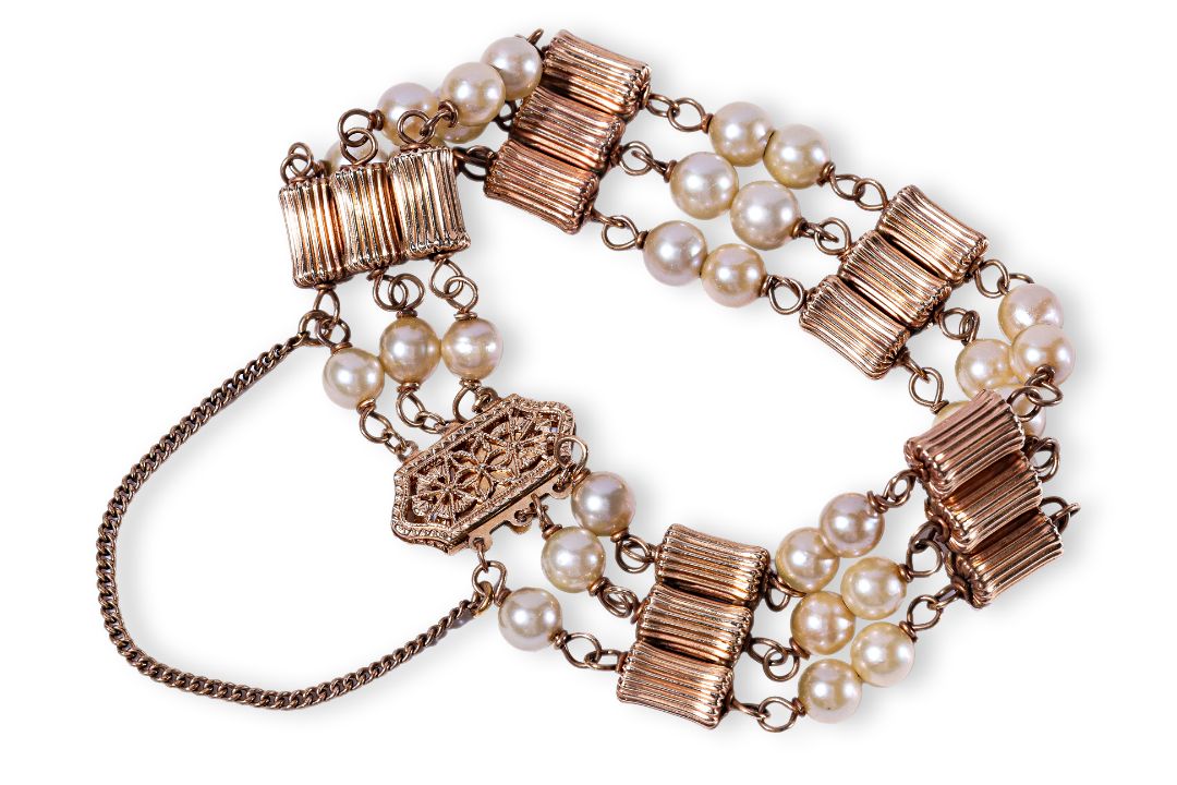A CULTURED PEARL THREE ROW GOLD BRACELET - Image 1 of 4