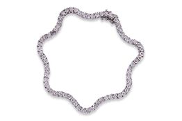 A DIAMOND 'WAVY' TENNIS BRACELET