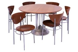 AN EXTENDING DINING TABLE AND SET OF SIX CHAIRS