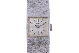 A LONGINES LADIES' WHITE GOLD BRACELET WATCH