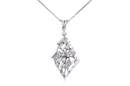 A DIAMOND PENDANT ON A LONG CHAIN