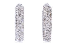 A PAIR OF THREE-ROW DIAMOND HOOP EARRINGS