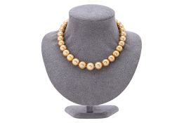 A GOLDEN SOUTH SEA CULTURED PEARL STRAND NECKLACE