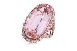 A LARGE MORGANITE AND DIAMOND RING