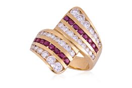 A RUBY AND DIAMOND CROSSOVER RING