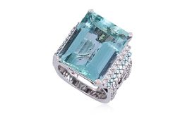 AN AQUAMARINE AND DIAMOND RING BY HUBERT