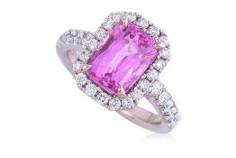 A PINK SAPPHIRE AND DIAMOND 'HALO' RING