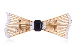 AN ONYX AND DIAMOND BROOCH