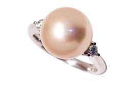 A CULTURED YELLOW SOUTH SEA PEARL AND DIAMOND RING