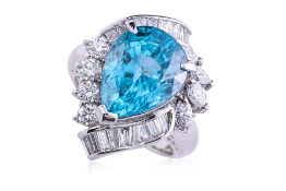 A LARGE BLUE ZIRCON AND DIAMOND RING