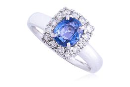 A SAPPHIRE AND DIAMOND 'HALO' RING