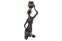 A STATUE OF AN AFRICAN WOMAN